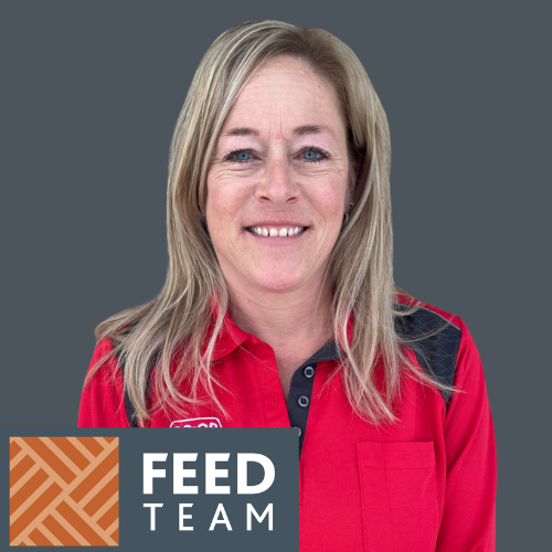 A smiling Co-op employee wearing a red shirt with black accents. She had shoulder length blonde hair. Below the words Feed Team appear in a grey box. To the left a geometric brown and beige pattern is shown.