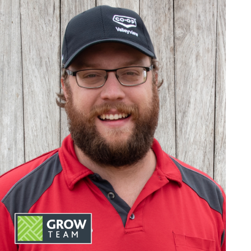 Headshot of Tyler Clarke wearing a red Co-op shirt and black Co-op ball cap
