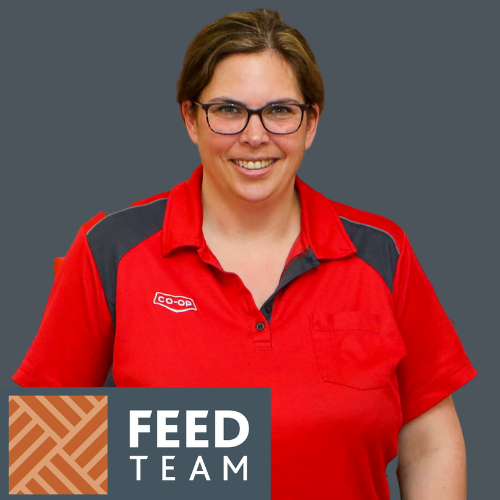 A smiling Co-op employee wears a short-sleeved red shirt with black accents. Her dark brown hair is pulled into a bun, and she is wearing glasses. The words Feed Team appear in a grey box, with a brown and beige geometric pattern to the left.